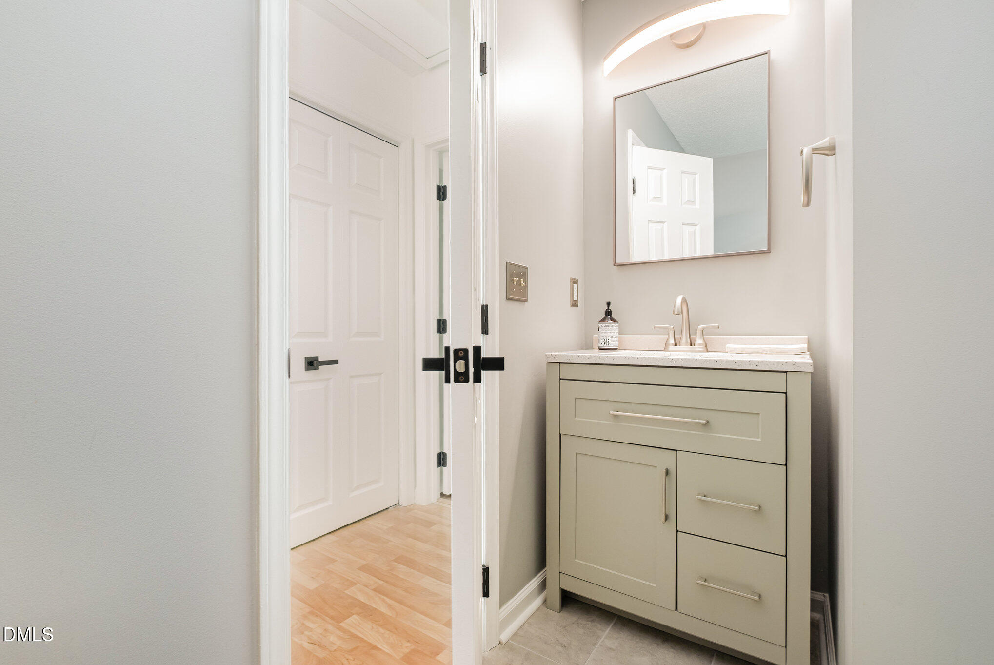2916 Bannf Court Raleigh, NC 27604 - Photo 21 of 31 a bathroom with a sink vanity and a mirror