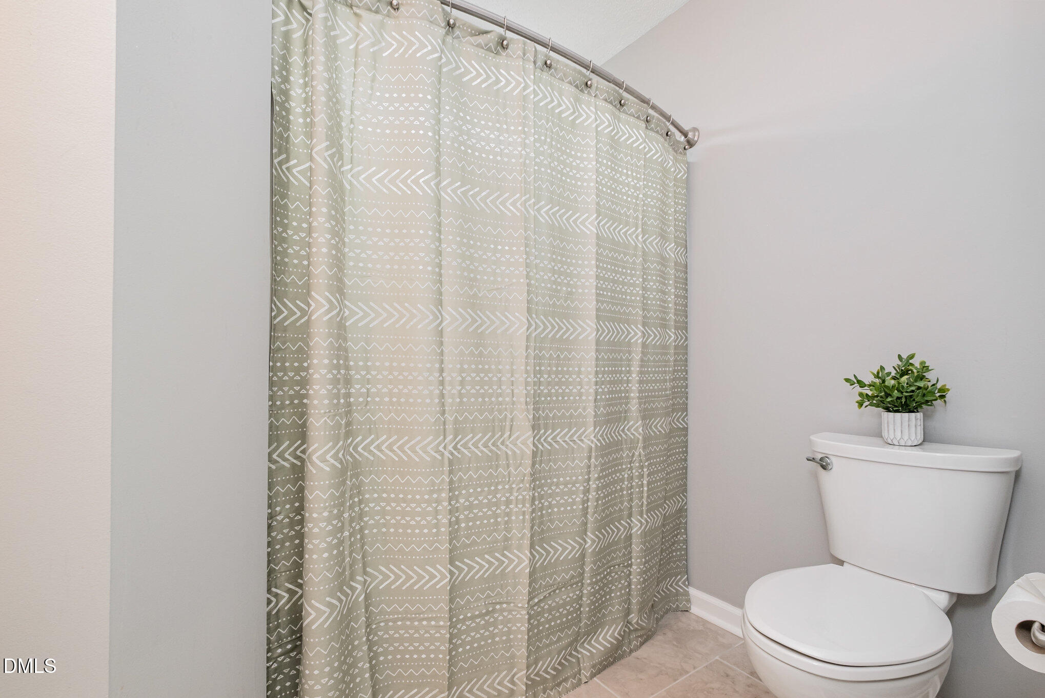 2916 Bannf Court Raleigh, NC 27604 - Photo 22 of 31 a white toilet sitting next to a shower curtain