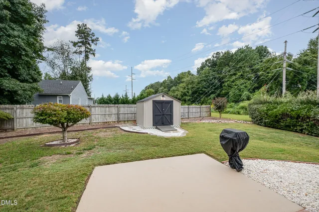 a swimming pool with lots of tress in front of it
