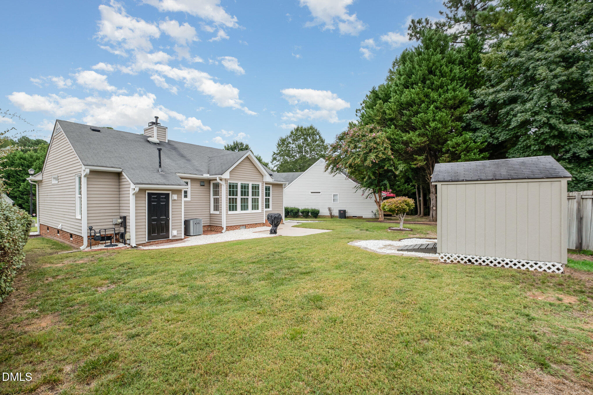 2916 Bannf Court Raleigh, NC 27604 - Photo 29 of 31 a front view of a house with a garden and yard