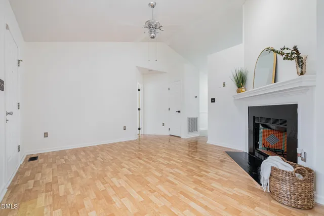 a bedroom with a bed and a fireplace