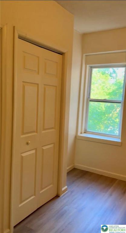 402 Ridge Avenue, Unit 4N Allentown, PA 18102 - Photo 5 of 9 a view of an empty room with wooden floor and a window