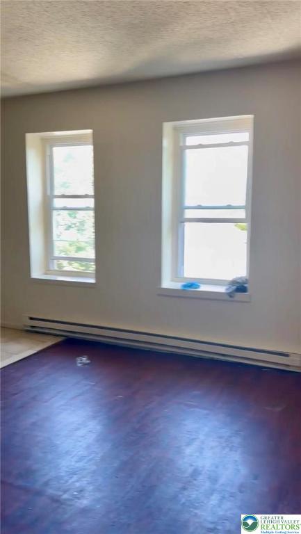 402 Ridge Avenue, Unit 4N Allentown, PA 18102 - Photo 9 of 9 an empty room with wooden floor and windows
