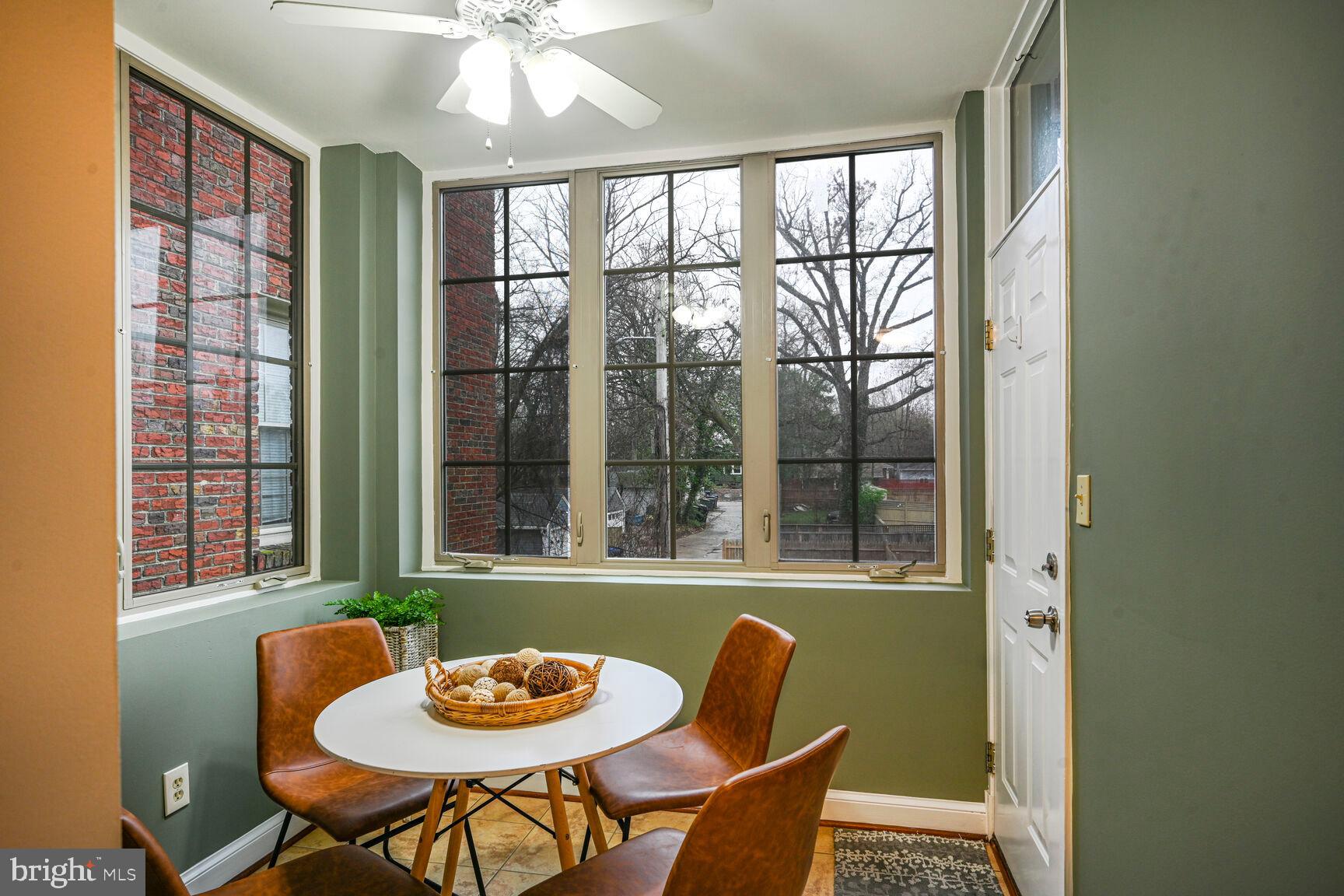 6722 3rd Street Northwest, Unit 203 Washington, DC 20012 - Photo 13 of 18 a view of a dining room with furniture window and outside view
