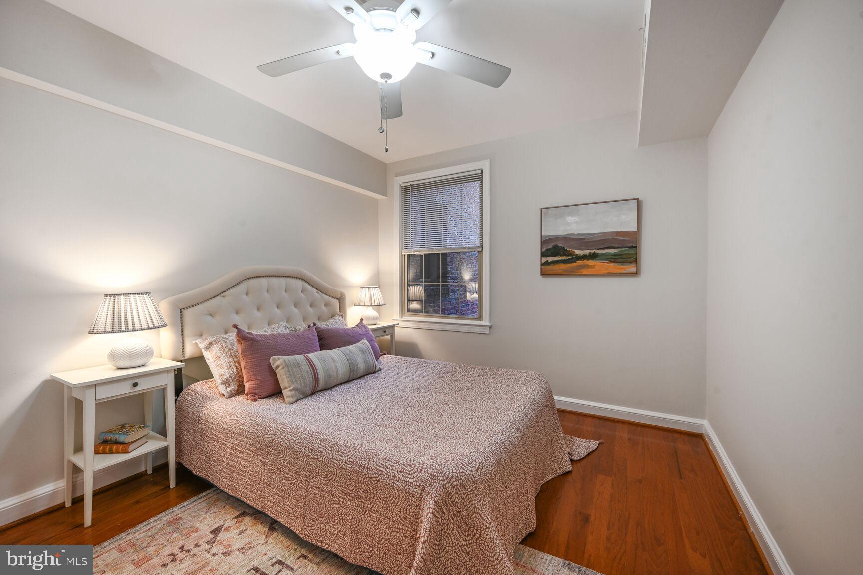 6722 3rd Street Northwest, Unit 203 Washington, DC 20012 - Photo 16 of 18 a bedroom with a bed and a lamp