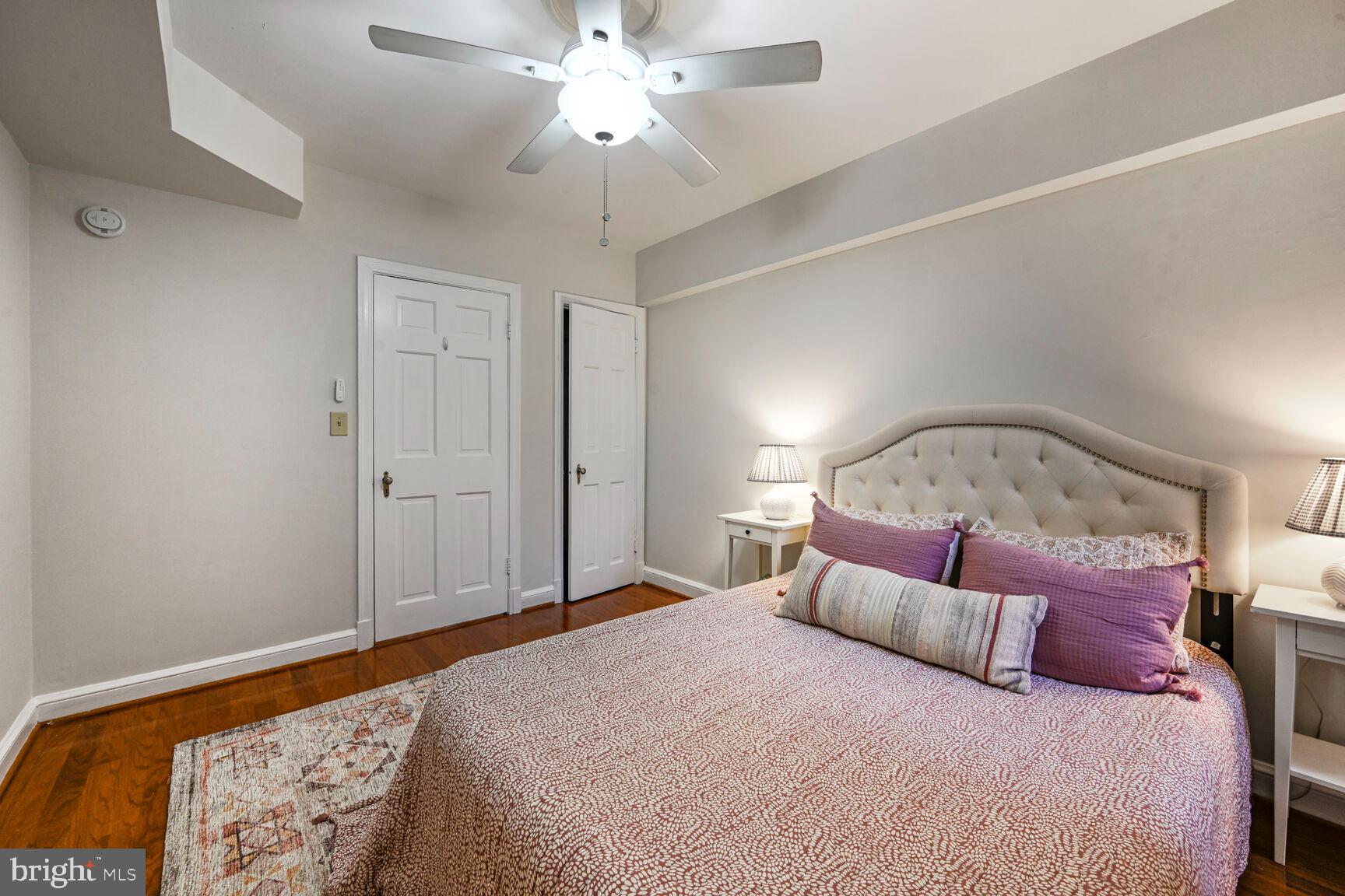 6722 3rd Street Northwest, Unit 203 Washington, DC 20012 - Photo 18 of 18 a bedroom with a large bed and a chandelier