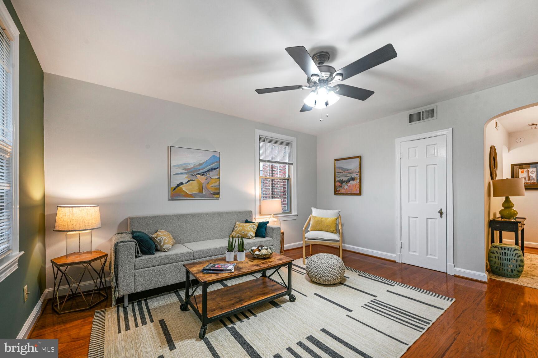6722 3rd Street Northwest, Unit 203 Washington, DC 20012 - Photo 5 of 18 a living room with furniture and wooden floor