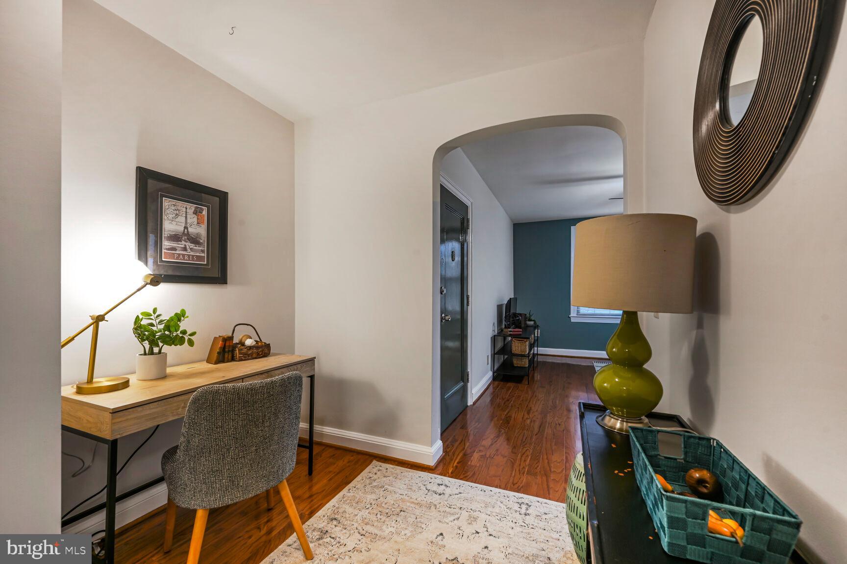 6722 3rd Street Northwest, Unit 203 Washington, DC 20012 - Photo 6 of 18 a living room with furniture and a mirror