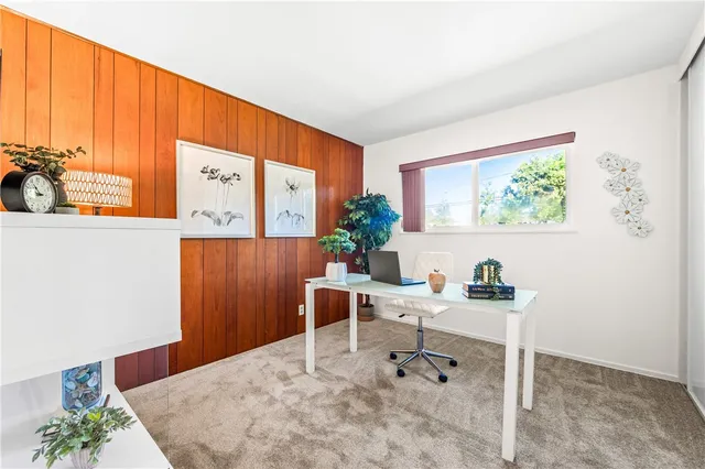 a workspace with furniture and window