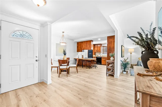 a view of a livingroom with furniture window and wooden floor
