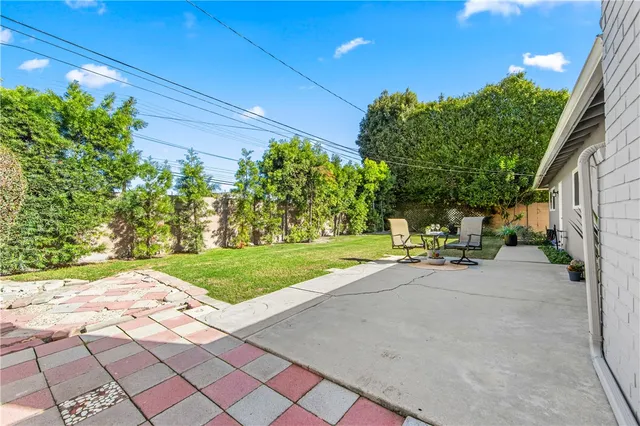 a view of a swimming pool with chair and table