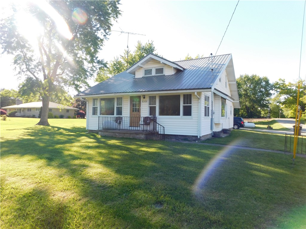 1301 East Main Street Casey, IL 62420 - Photo 2 of 14 a view of a house with a swimming pool