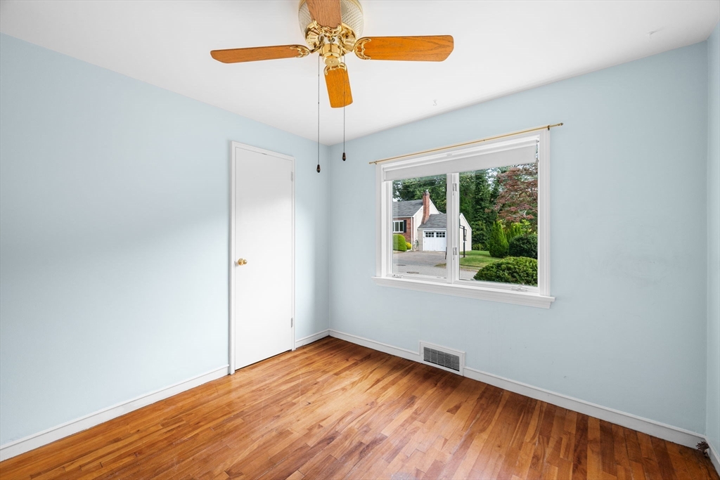11 May Street Marblehead, MA 01945 - Photo 12 of 22 an empty room with wooden floor fan and windows
