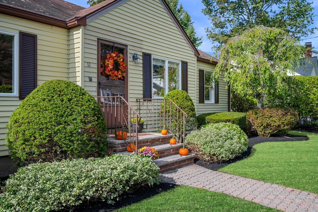 11 May Street Marblehead, MA 01945 - Photo 2 of 22 a front view of a house with garden