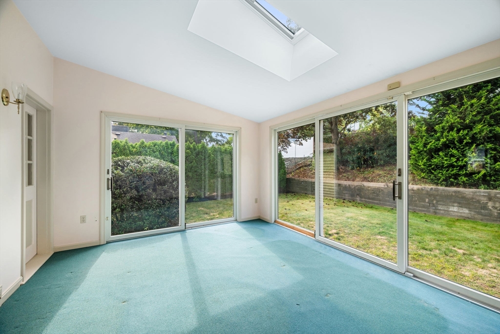 11 May Street Marblehead, MA 01945 - Photo 7 of 22 a view of an empty room with wooden floor and a balcony