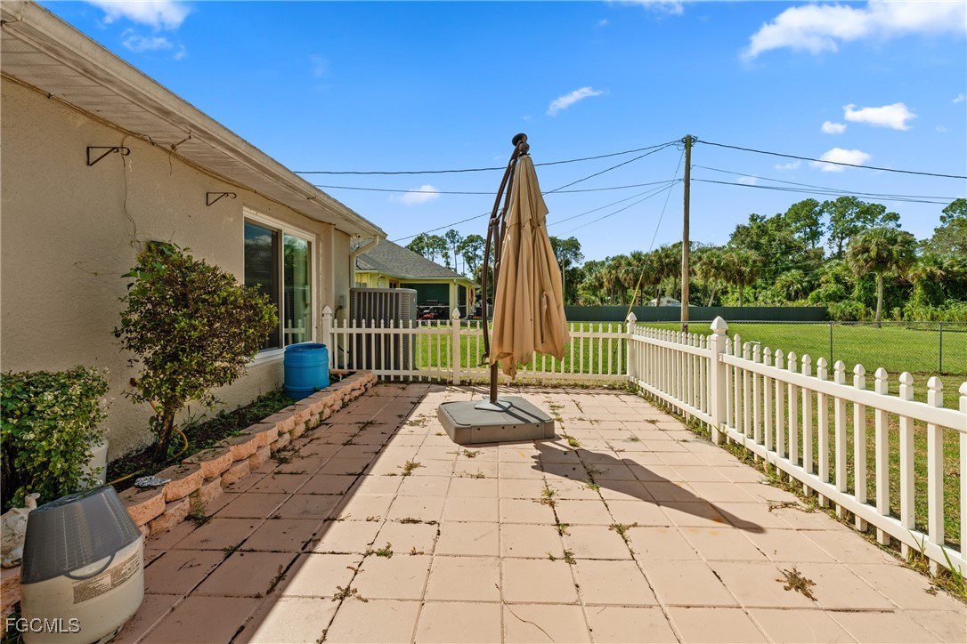 609 Gerald Avenue Lehigh Acres, FL 33936 - Photo 24 of 45 a view of a pathway with a garden