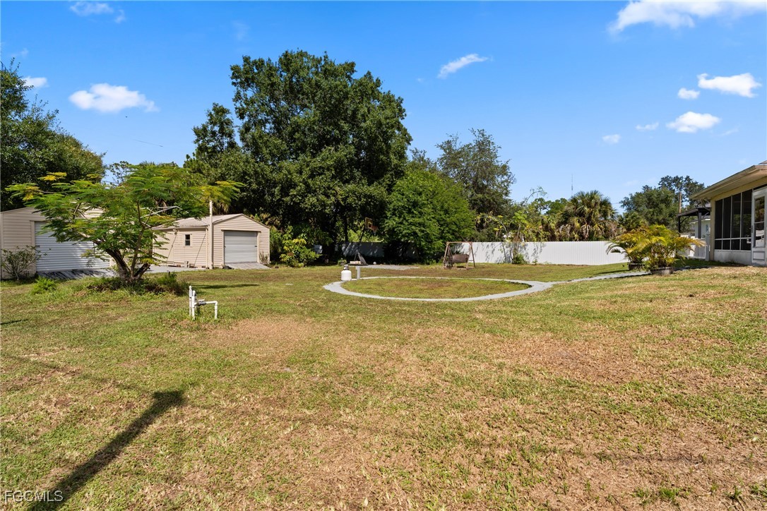 609 Gerald Avenue Lehigh Acres, FL 33936 - Photo 28 of 45 a view of a playground with basketball court