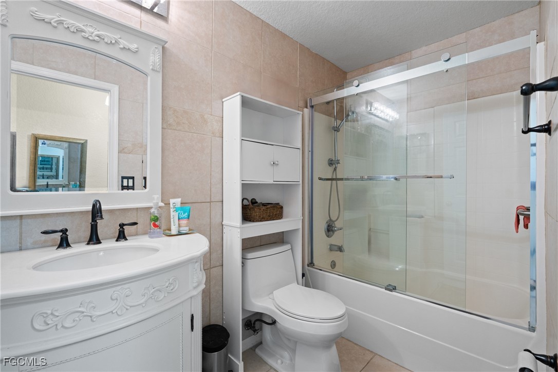 609 Gerald Avenue Lehigh Acres, FL 33936 - Photo 42 of 45 a bathroom with a sink toilet and shower