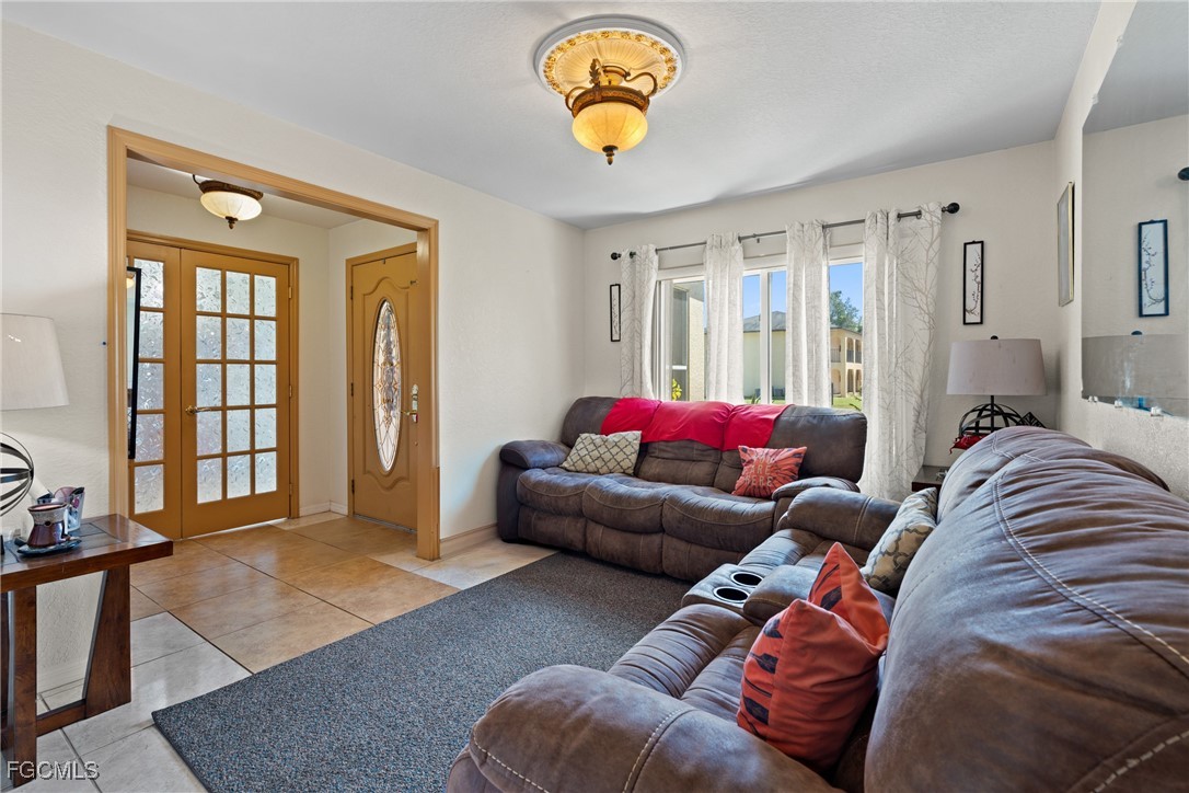 609 Gerald Avenue Lehigh Acres, FL 33936 - Photo 10 of 45 a living room with furniture and a window