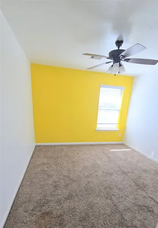 a view of a livingroom with an empty space and window