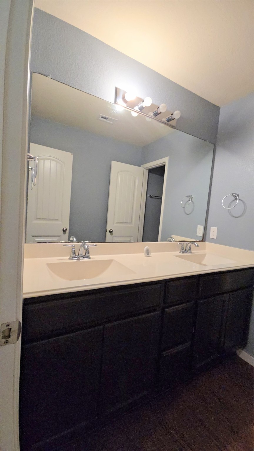 9918 Channel Set Way Rosharon, TX 77583 - Photo 18 of 21 a bathroom with a double vanity sink and a mirror