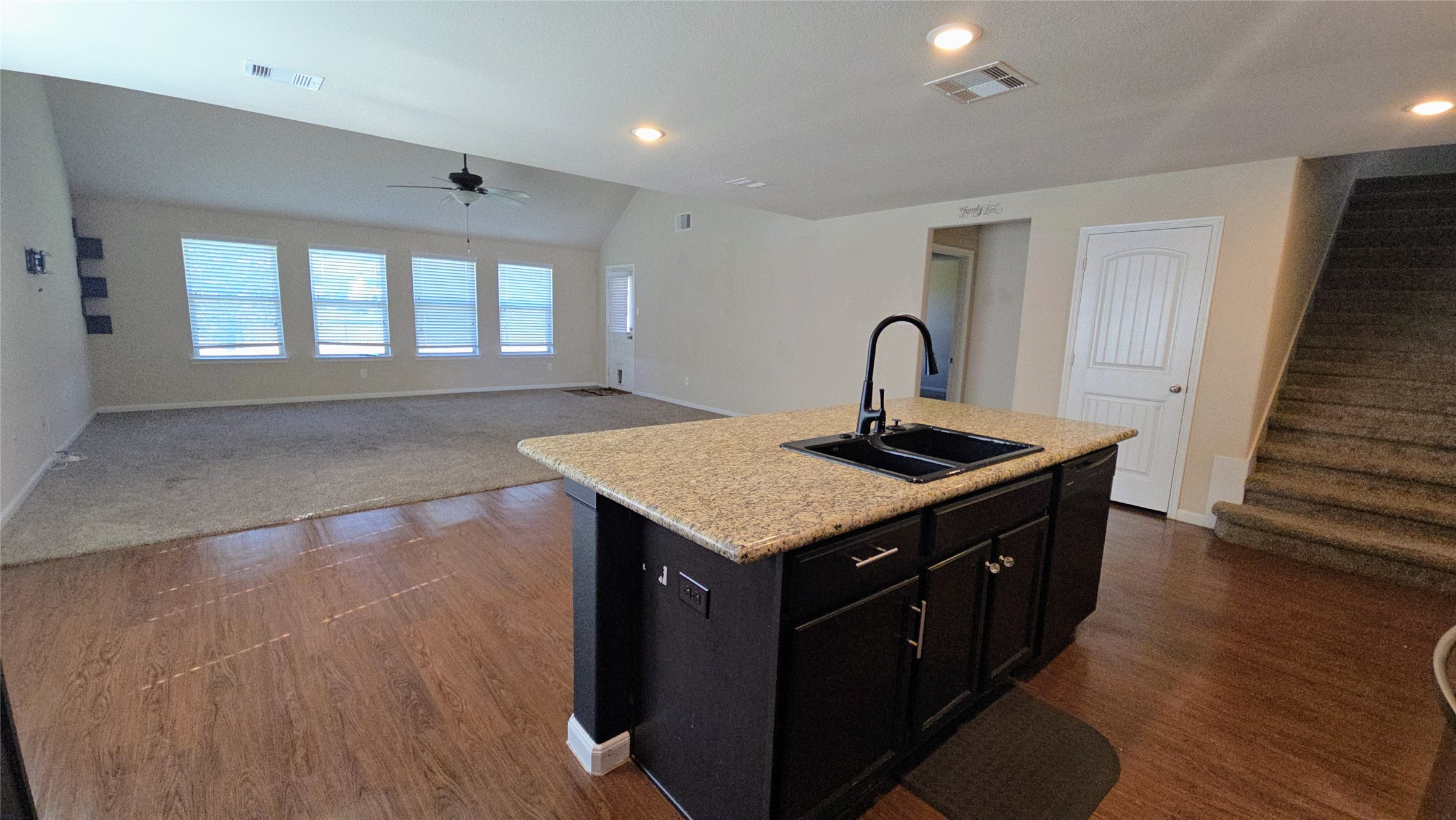 9918 Channel Set Way Rosharon, TX 77583 - Photo 3 of 21 a kitchen with a sink and a wooden floor