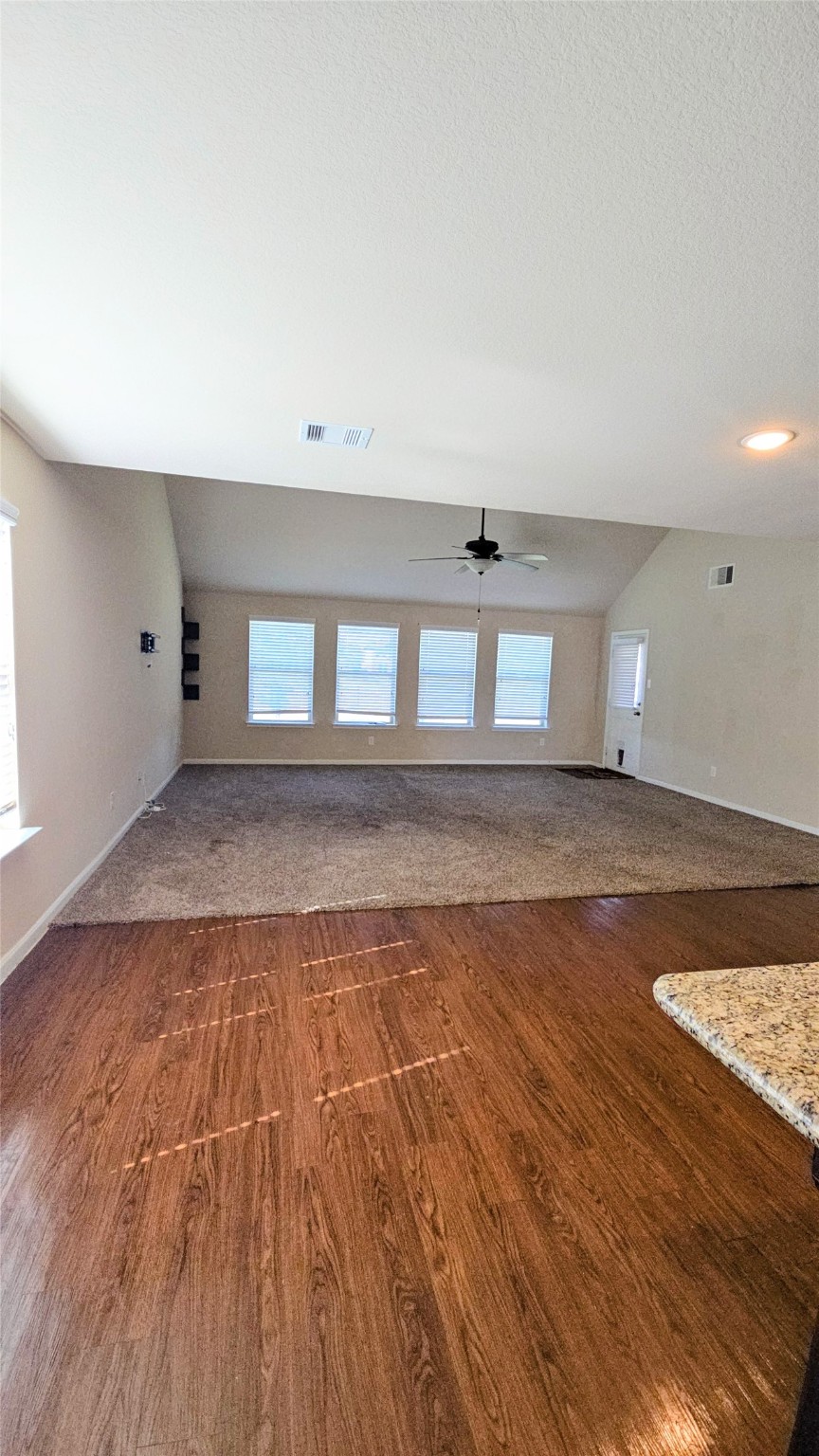9918 Channel Set Way Rosharon, TX 77583 - Photo 6 of 21 an empty room with wooden floor and windows