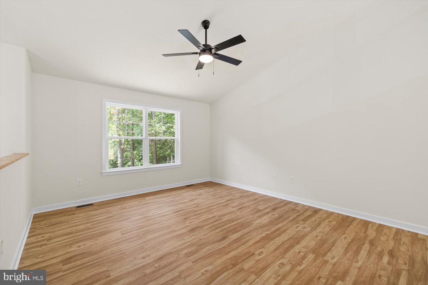 3319 Partlow Road Partlow, VA 22534 - Photo 12 of 47 an empty room with wooden floor and windows