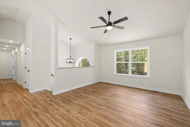 a view of a kitchen with a dishwasher cabinets and wooden floor