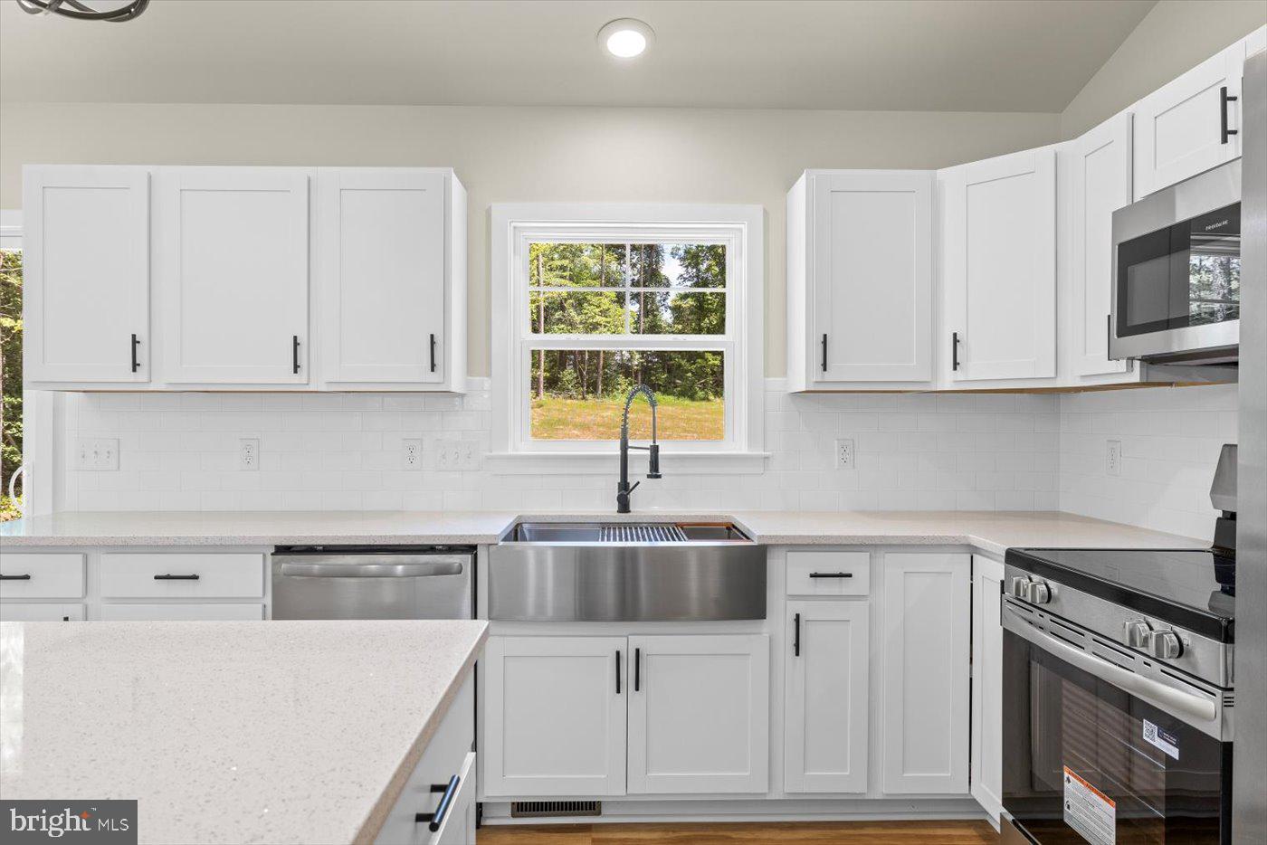 3319 Partlow Road Partlow, VA 22534 - Photo 19 of 47 a kitchen with granite countertop a sink and a stove