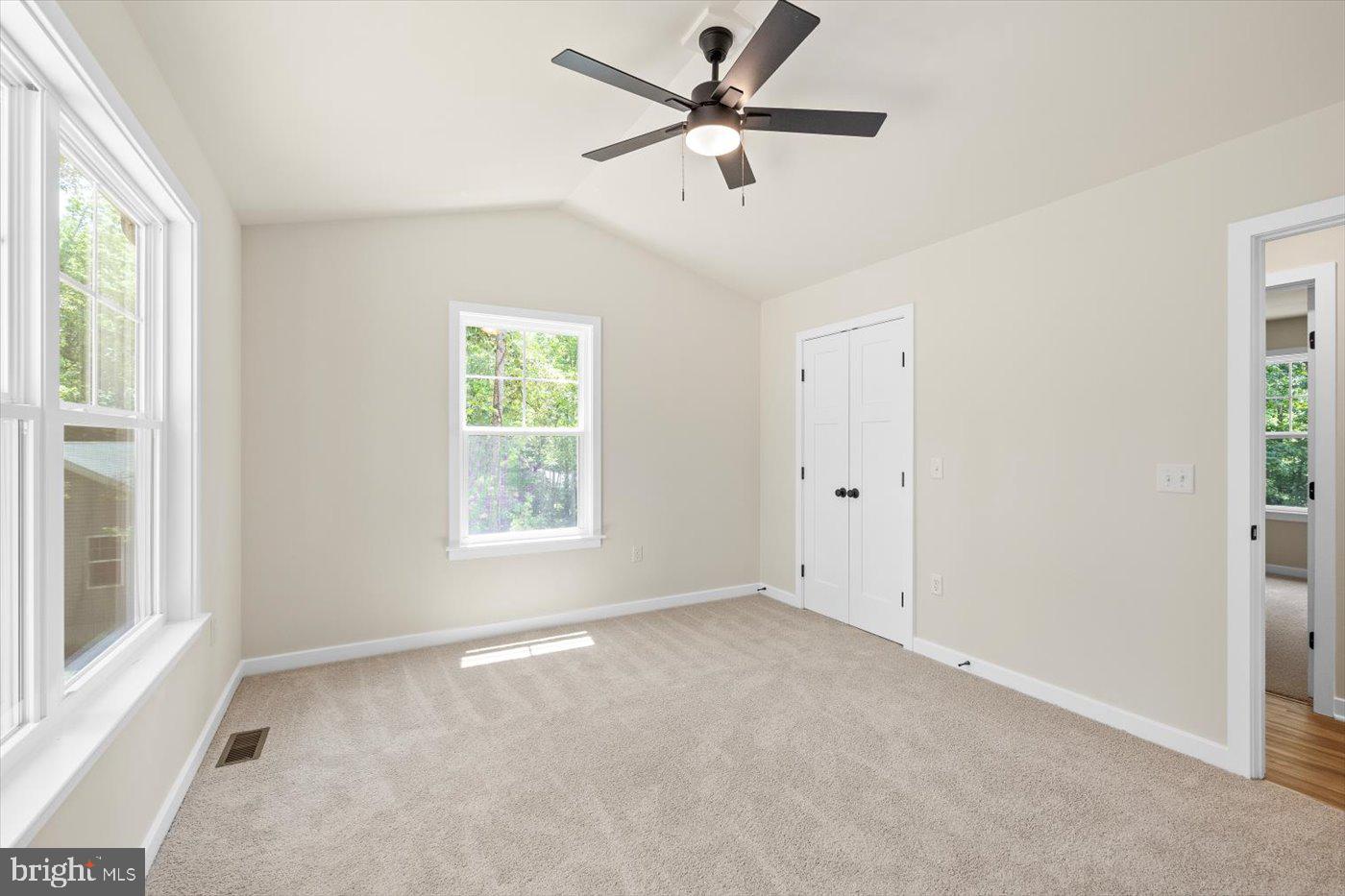 3319 Partlow Road Partlow, VA 22534 - Photo 32 of 47 a view of a big room with windows and chandelier fan