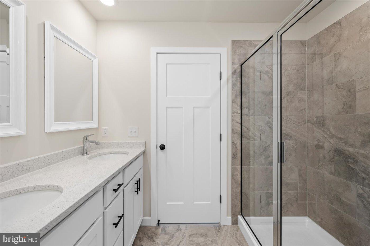3319 Partlow Road Partlow, VA 22534 - Photo 34 of 47 a bathroom with a shower sink and mirror
