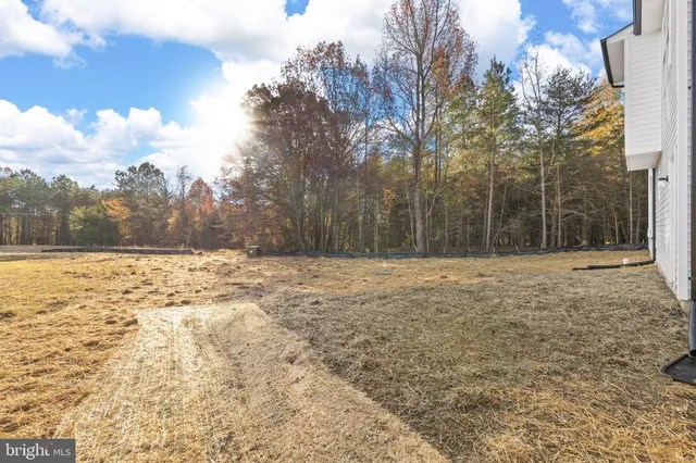 a view of a house with a snow in the yard