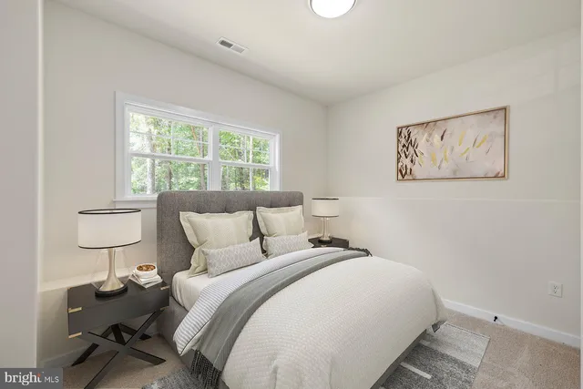 a view of a workspace with furniture and a potted plant