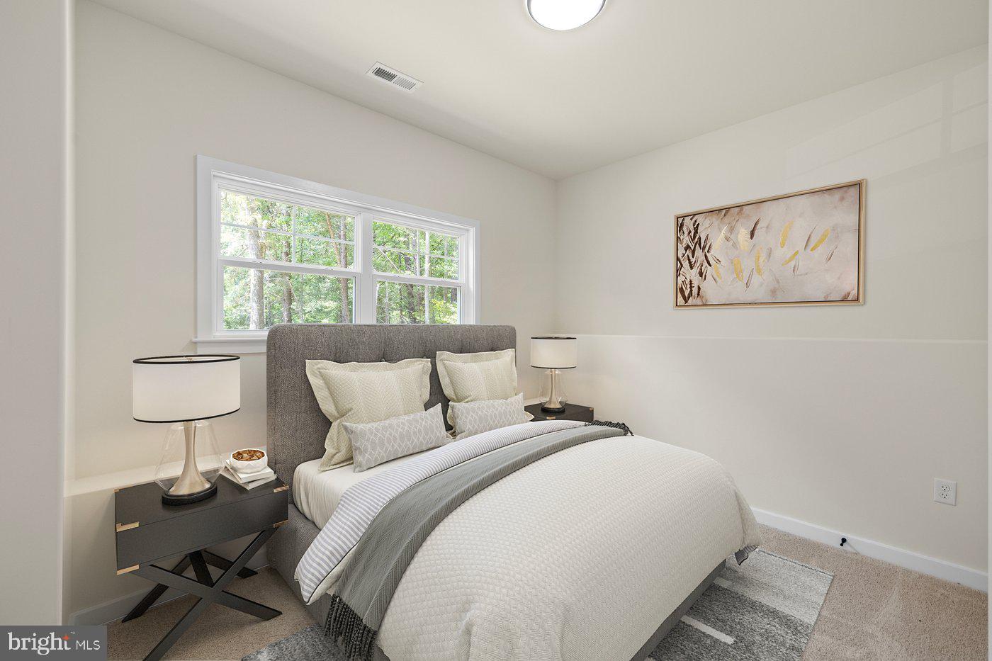 3319 Partlow Road Partlow, VA 22534 - Photo 9 of 47 a bedroom with a bed and a painting on the wall