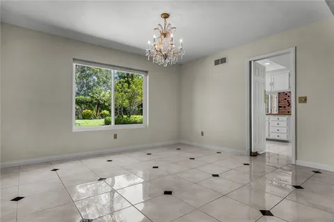 a view of kitchen with furniture and natural light