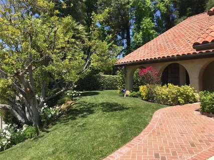 a view of a house with a garden