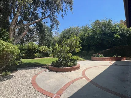 a view of a patio with a table and chairs