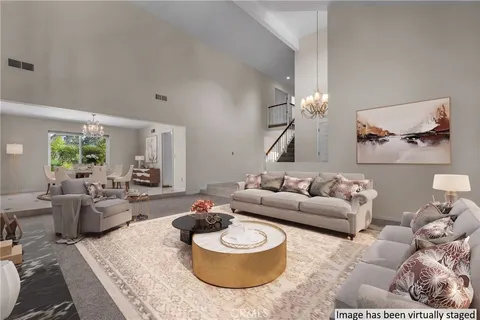 a living room with furniture and a rug