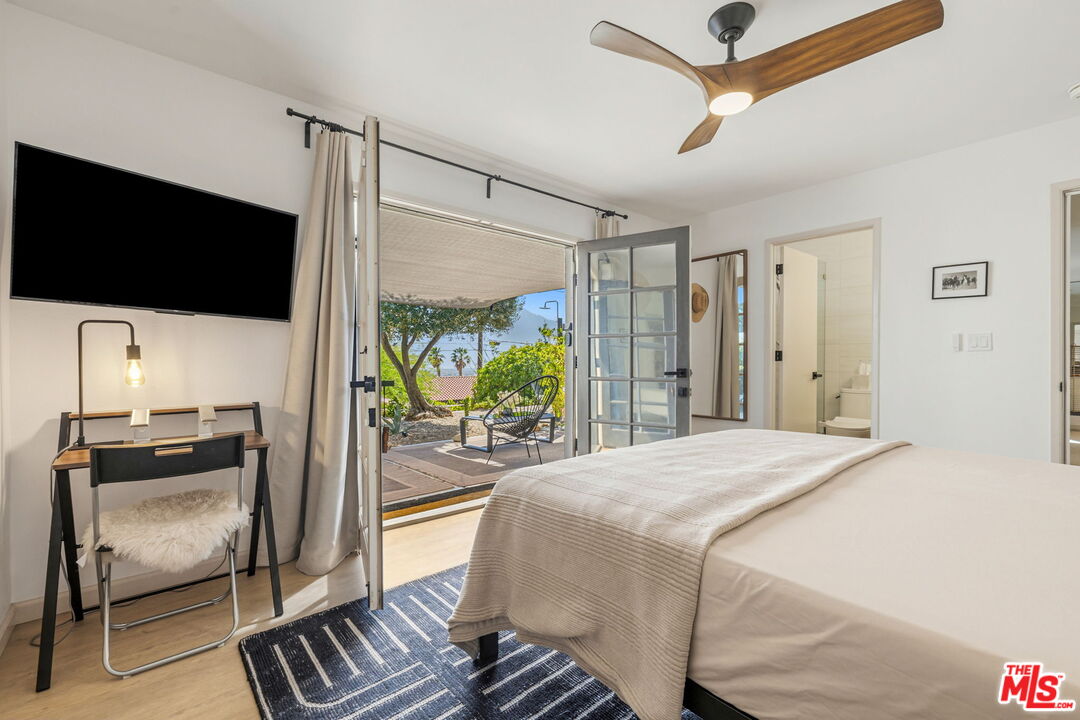 66869 San Ardo Road Desert Hot Springs, CA 92240 - Photo 19 of 39 a bedroom with a bed and a television