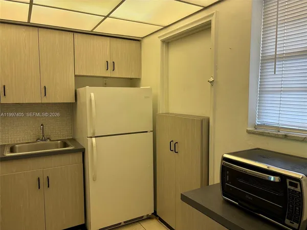 a view of a swimming pool with a table and chairs