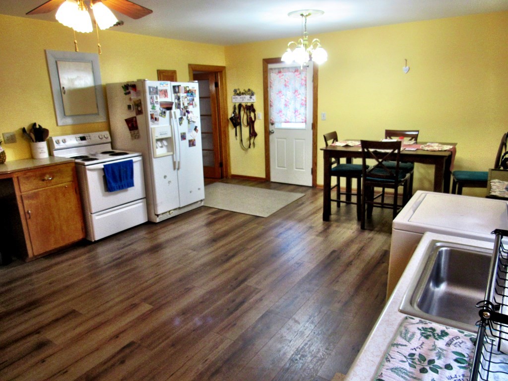 2340 Main Street Three Rivers, MA 01080 - Photo 12 of 31 a view of a kitchen with furniture and wooden floor