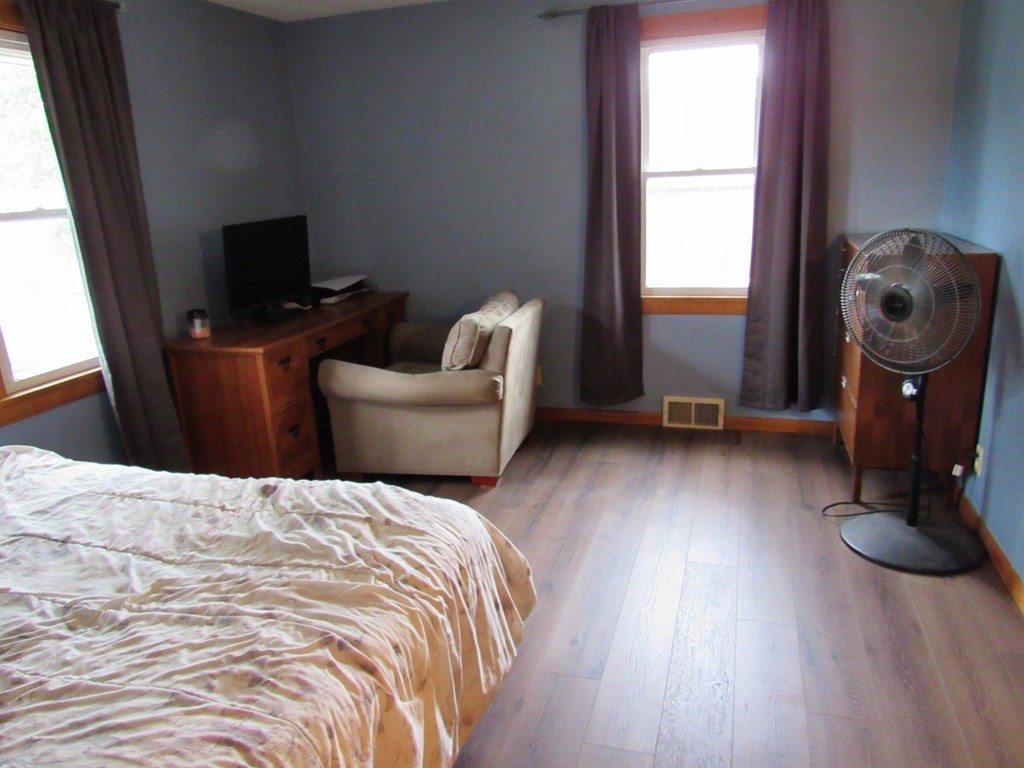 2340 Main Street Three Rivers, MA 01080 - Photo 19 of 31 a bedroom with a bed and wooden floor