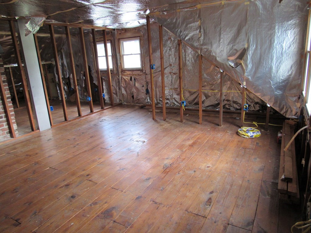 2340 Main Street Three Rivers, MA 01080 - Photo 26 of 31 a view of an empty room with wooden floor and windows