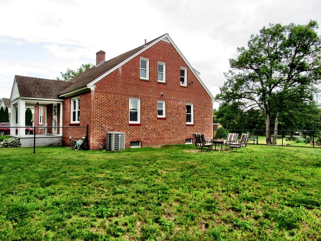 2340 Main Street Three Rivers, MA 01080 - Photo 4 of 31 a front view of a house with a yard