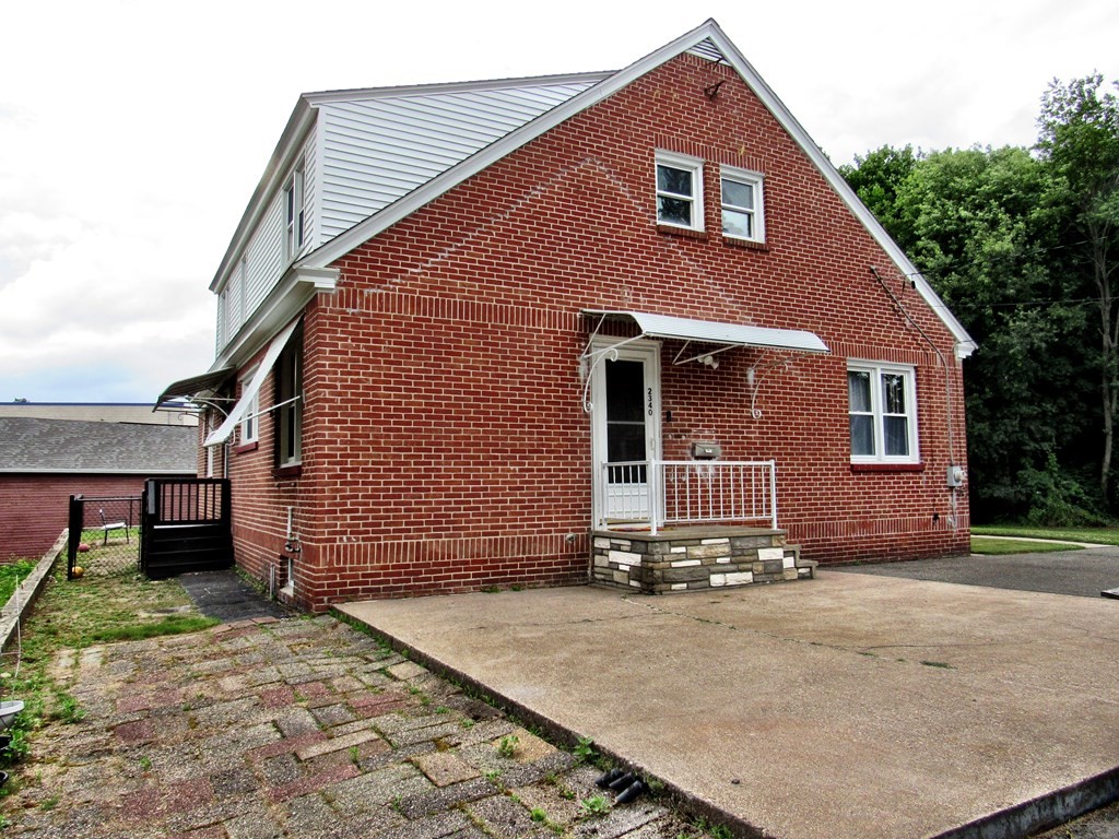 2340 Main Street Three Rivers, MA 01080 - Photo 6 of 31 a front view of a house with a yard