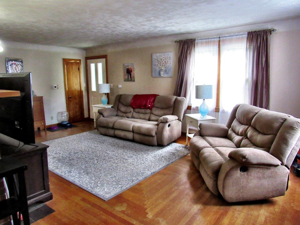 2340 Main Street Three Rivers, MA 01080 - Photo 7 of 31 a living room with furniture and a window