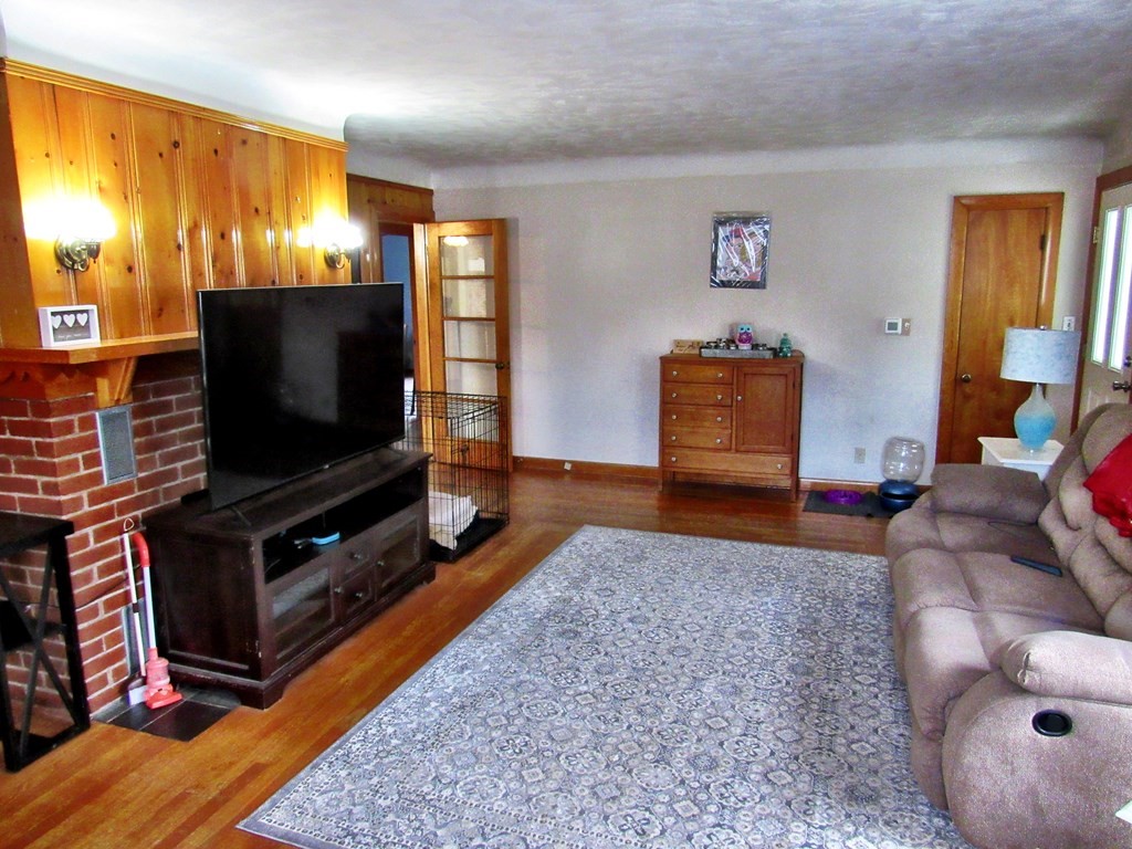 2340 Main Street Three Rivers, MA 01080 - Photo 8 of 31 a living room with furniture and a flat screen tv