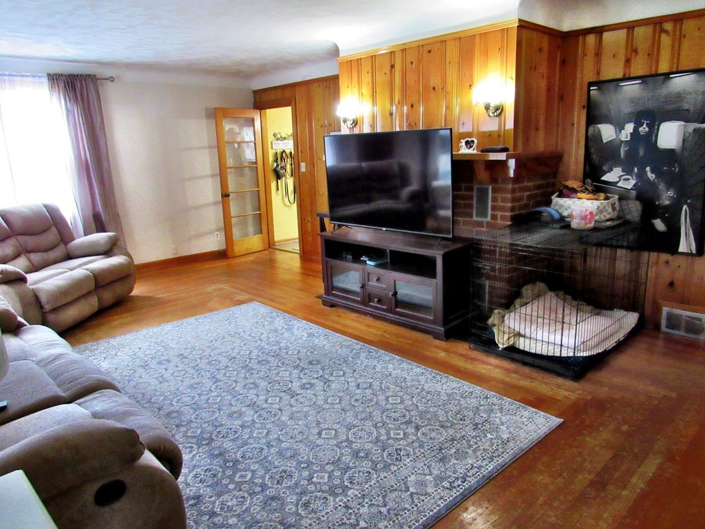 2340 Main Street Three Rivers, MA 01080 - Photo 9 of 31 a living room with furniture and a flat screen tv