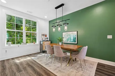 a view of a dining room with furniture window and outside view